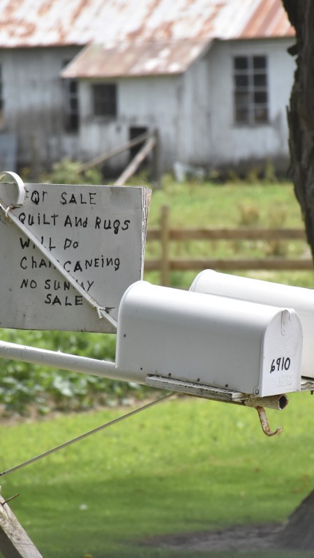Quilt, Rugs and chair caning sign in Leon