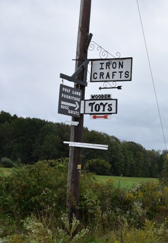 Amish business signs on a telephone post.