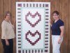 Crystal Abers and Sue Sandy with a Barn Quilt